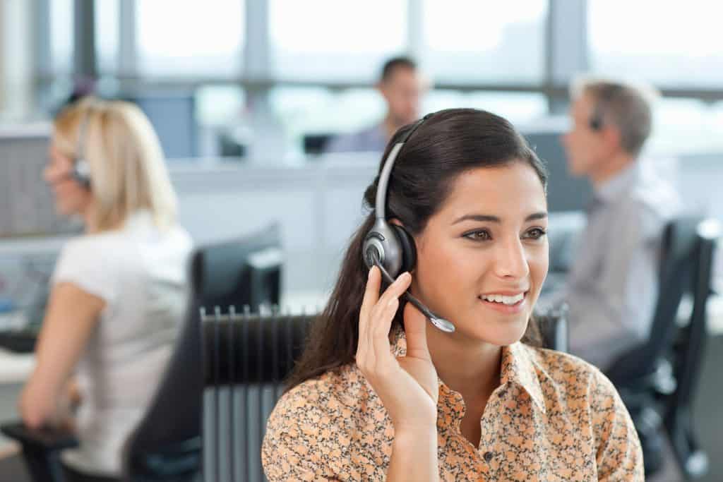 woman answering calls at a plumbing call center